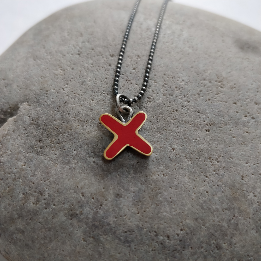 Red cross/kiss necklace